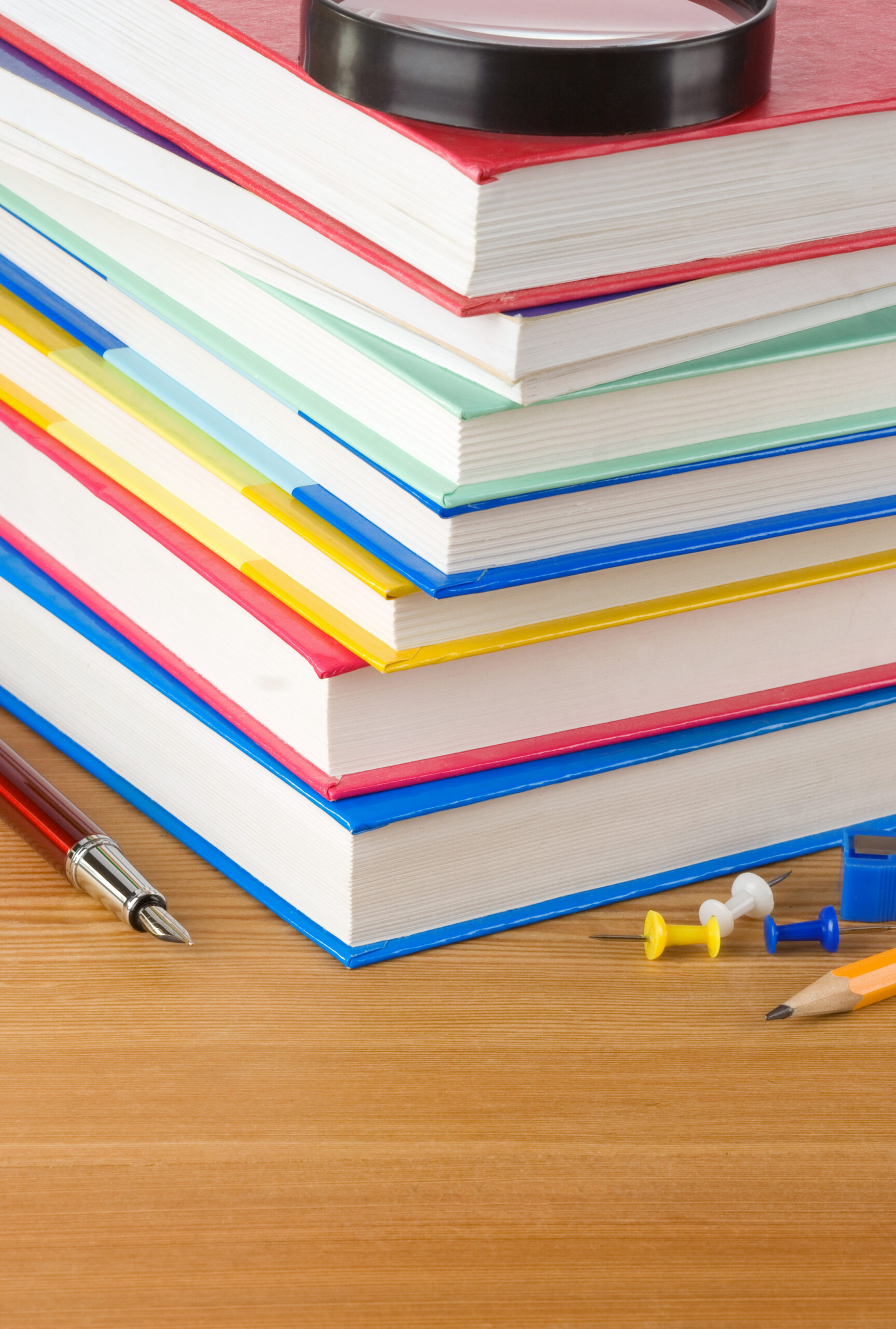 pile of books on wood background